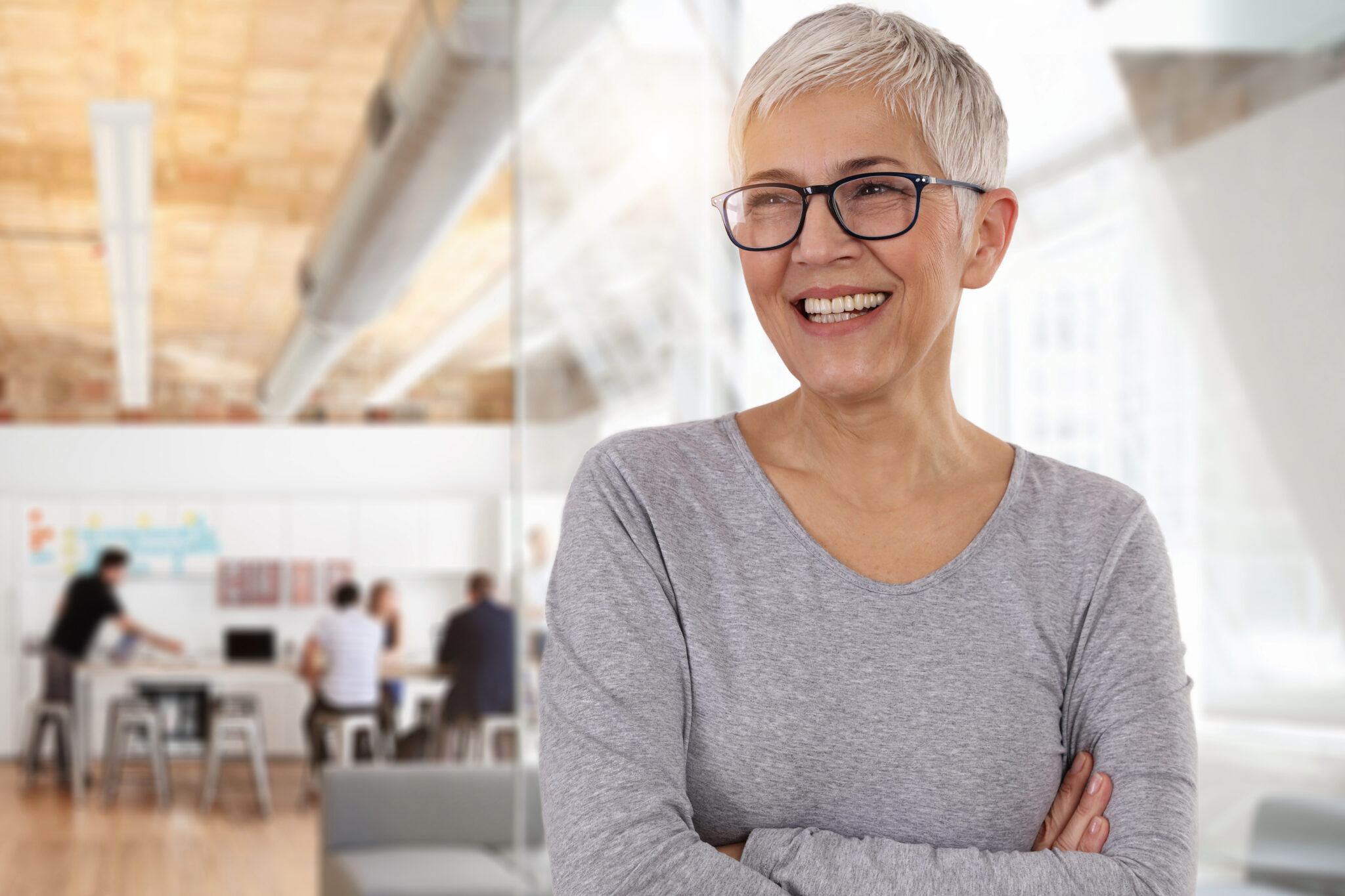 Happy smiling business woman in an office. Teamwork , success concept
